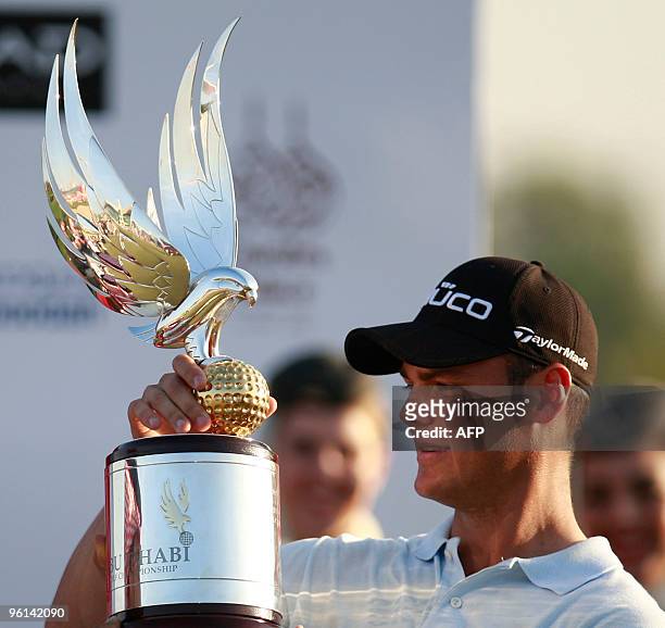Martin Kaymer of Germany poses with the trophy after winning the 1.5 million euro Abu Dhabi Golf Championship for the second time in three years on...