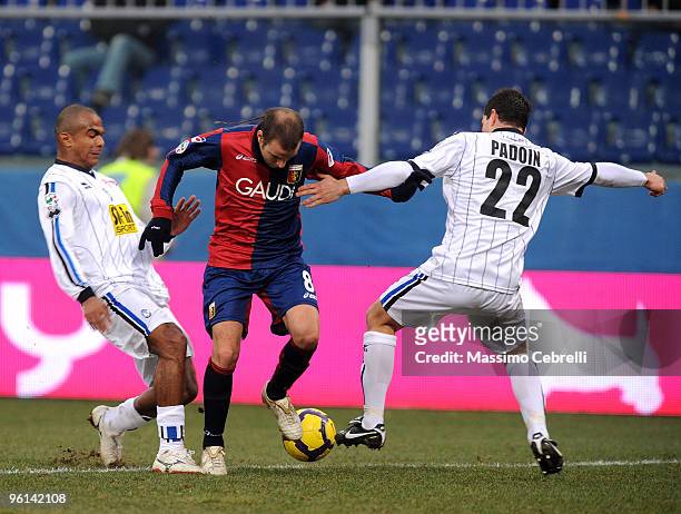 Rodrigo Palacio of Genoa CFC battles for the ball against Adriano Ferreira Pinto and Simone Padoin of Atalanta BC during the Serie A match between...