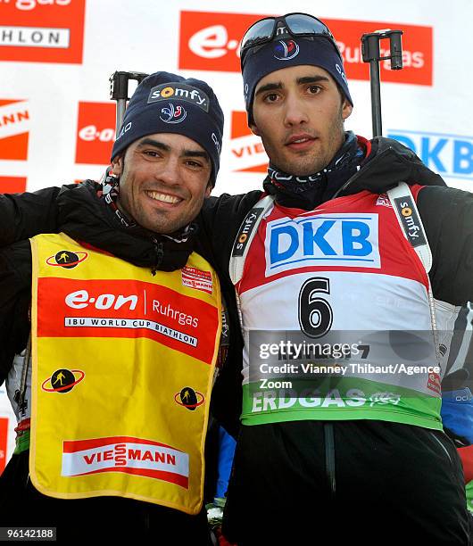 Simon Fourcade of France takes 1st place of overall ranking of the IBU World Cup, and poses with Martin Fourcade of France during the e.on Ruhrgas...