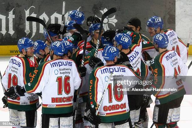 Players of Augsburg celebrate winning the match after penalty shoot out of the DEL match between Thomas Sabo Ice Tigers and Augsburger Panther at the...