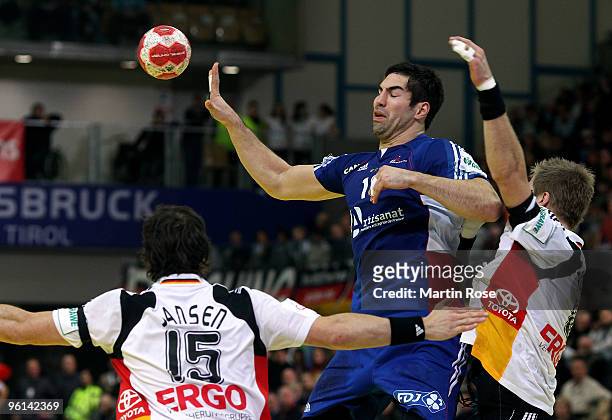 Oliver Roggisch of Germany in action with Nikola Karabatic of France during the Men's Handball European main round Group II match between Germany and...