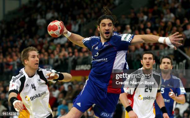 Bertrand Gille of France throws at goal during the Men's Handball European main round Group II match between Germany and France at the Olympia Hall...