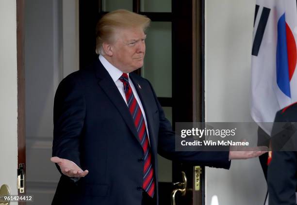 President Donald Trump gestures to Republic of Korea President Moon Jae-in as Moon arrives at the White House May 22, 2018 in Washington, DC. Trump...