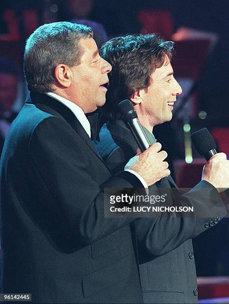 Comedian Jerry Lewis sings with comedian Martin Short at the start of the 34th annual Jerry Lewis Telethon to benefit the Muscular Dystrophy...