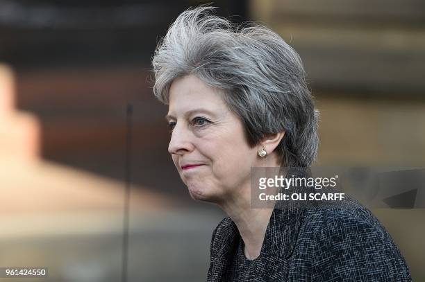 Britain's Prime Minister Theresa May leaves after attending The Manchester Arena National Service of Commemoration at Manchester Cathedral in central...