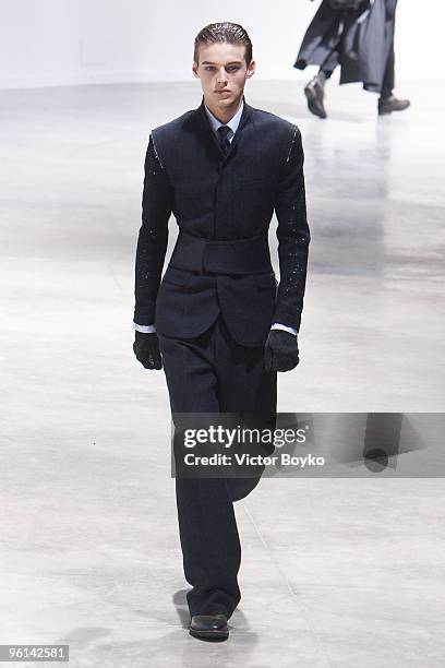 Model walks the runway at the Lanvin fashion show during Paris Menswear Fashion Week Autumn/Winter 2010 at Palais De Tokyo on January 24, 2010 in...