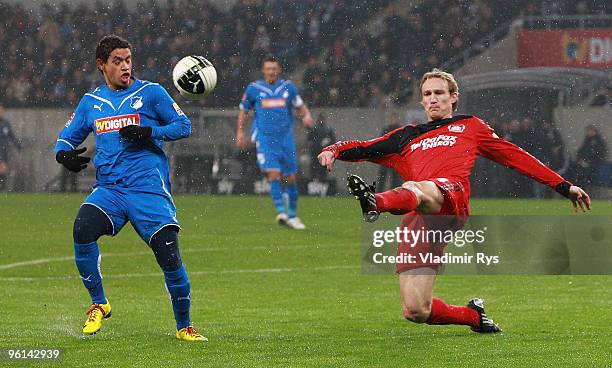 Sami Hyypiae of Leverkusen kicks away the ball in front of Carlos Eduardo of Hoffenheim during the Bundesliga match between 1899 Hoffenheim and Bayer...