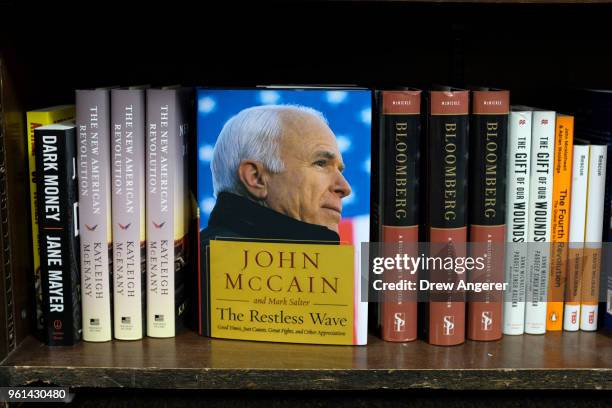 New book my Sen. John McCain , titled "The Restless Wave: Good Times, Just Causes, Great Fights, and Other Appreciations" sits for sale on a shelf at...