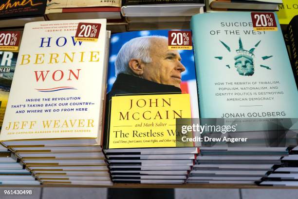 New book my Sen. John McCain , titled "The Restless Wave: Good Times, Just Causes, Great Fights, and Other Appreciations" sits for sale on a table at...