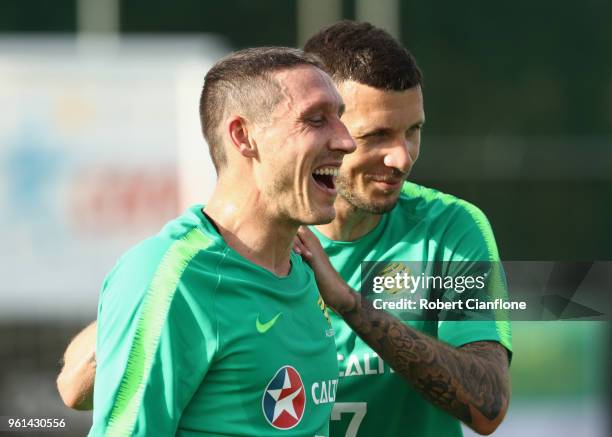 Mark Milligan and Nikita Rukavytsya of Australia laugh during the Australian Socceroos training session at the Gloria Football Club on May 22, 2018...