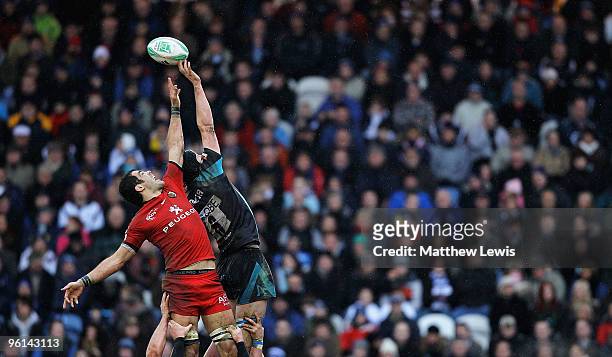 Gregory Lamboley of Toulouse and James Gaskell of Sale challenge for the ball during the Heineken Cup match between Sale Sharks and Toulouse at...
