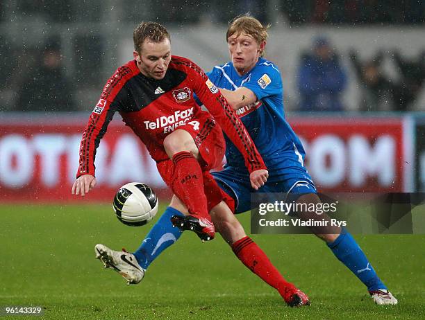 Michal Kadlec of Leverkusen controls the ball as Andreas Beck of Hoffenheim defends during the Bundesliga match between 1899 Hoffenheim and Bayer...