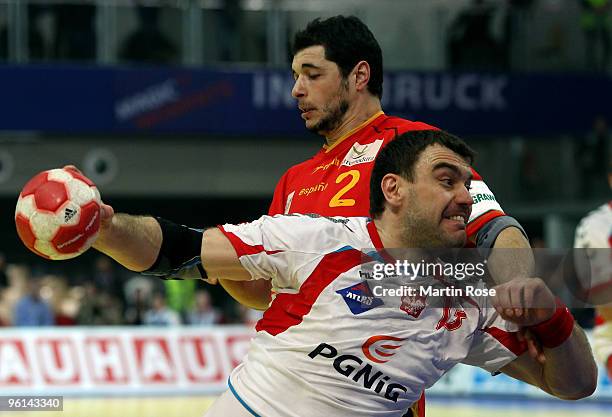 Bartosz Jurecki of Poland in action with Alberto Entrerrios of Spain during the Men's Handball European main round Group II match between Poland and...