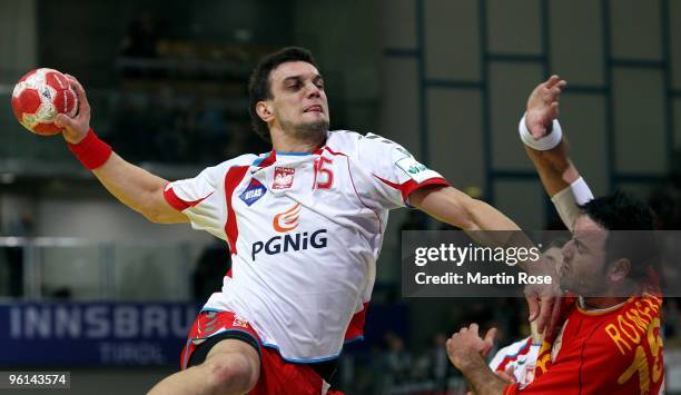 Michal Jurecki of Poland in action with Iker Romero of Spain during the Men's Handball European main round Group II match between Poland and Spain at...