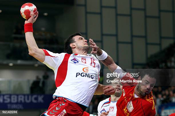 Michal Jurecki of Poland in action with Iker Romero of Spain during the Men's Handball European main round Group II match between Poland and Spain at...