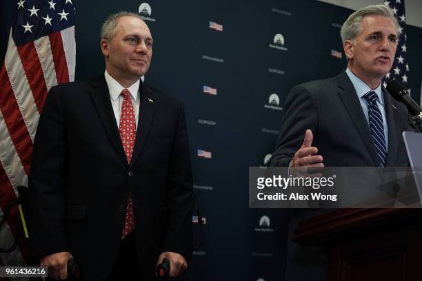 House Majority Leader Rep. Kevin McCarthy speaks as House Majority Whip Rep. Steve Scalise listens during a news briefing after a House Republican...
