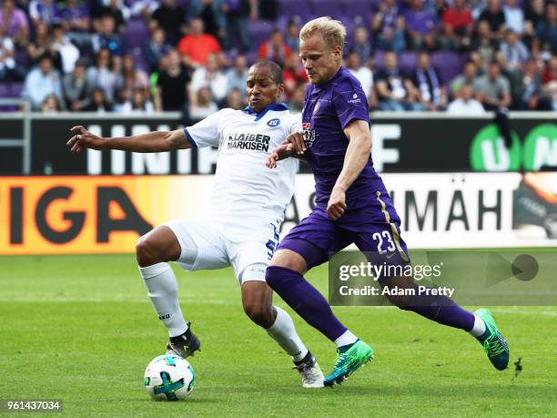 Soeren Bertram of FC Erzgebirge Aue is challenged by David Pisot of Karlsruher SC during the relegation 2018 2. Bundesliga Playoff Leg 2 match...