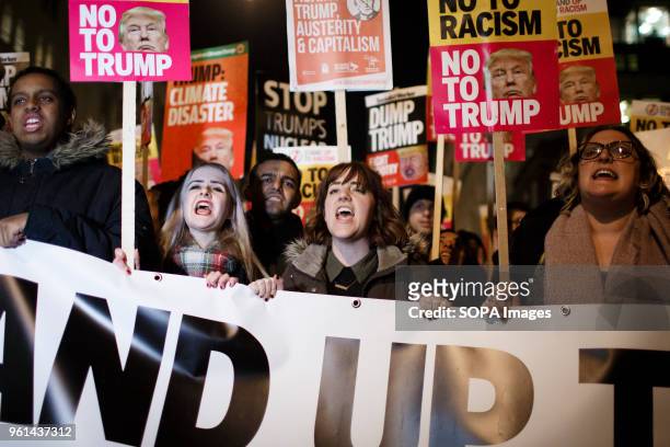 Demonstrators on Piccadilly take part in an impromptu anti-Trump march through central London following a protest outside the US Embassy in Grosvenor...