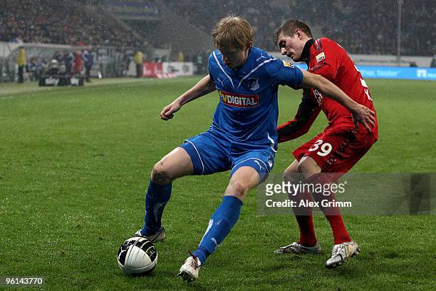 Andreas Beck of Hoffenheim is challenged by Toni Kroos of Leverkusen during the Bundesliga match between 1899 Hoffenheim and Bayer Leverkusen at the...