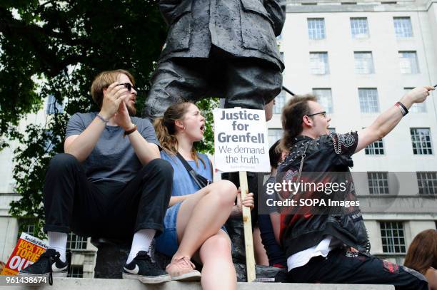 Protesters on Whitehall take part in a demonstration against British Prime Minister Theresa May organised in protest at her dispassionate-seeming...