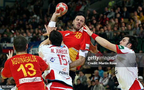 Michal Jurecki of Poland in action with Iker Romero of Spain during the Men's Handball European main round Group II match between Poland and Spain at...