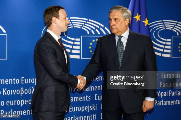 Mark Zuckerberg, chief executive officer and founder of Facebook Inc., left, shakes hands with Antonio Tajani, president of the European Parliament,...
