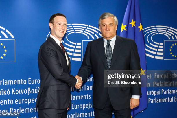 Mark Zuckerberg, chief executive officer and founder of Facebook Inc., left, shakes hands with Antonio Tajani, president of the European Parliament,...