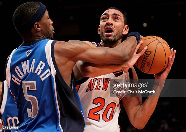 Jared Jeffries of the New York Knicks holds the ball away from Josh Howard of the Dallas Mavericks at Madison Square Garden January 24, 2010 in New...