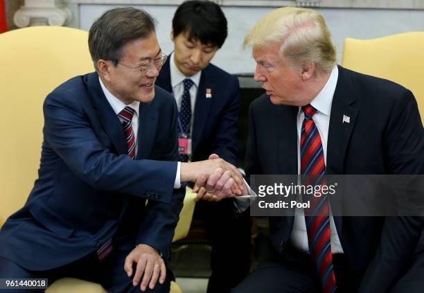 President Donald Trump shakes hands with South Korean President Moon Jae-in during a meeting in the Oval Office of the White House on May 22, 2018 in...
