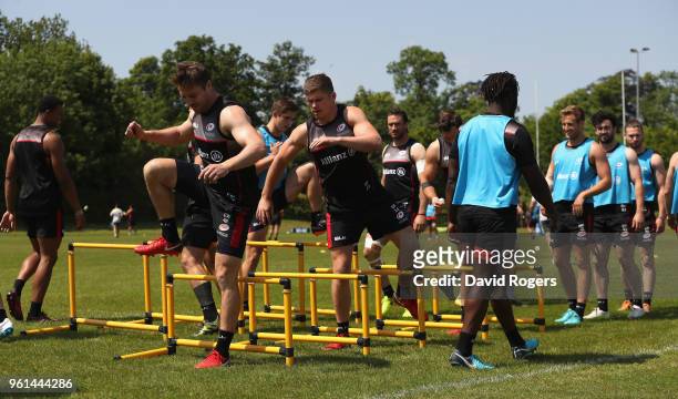 Saracens warm up during the Saracens training session held at Old Albanians on May 22, 2018 in St Albans, England.