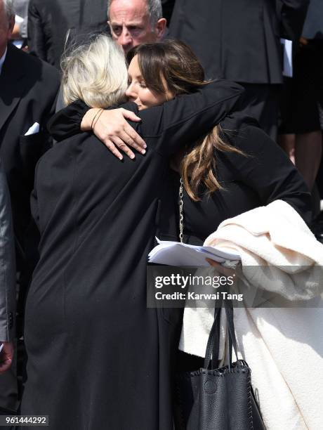 Martine McCutcheon is consoled by a mourner during the funeral of Dale Winton at the Old Church, 1 Marylebone Road on May 22, 2018 in London, England.