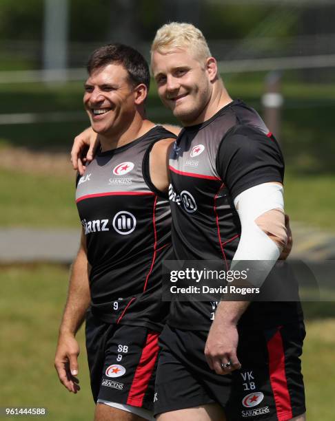 Schalk Brits and team mate Vincent Koch walk onto the pitch during the Saracens training session held at Old Albanians on May 22, 2018 in St Albans,...