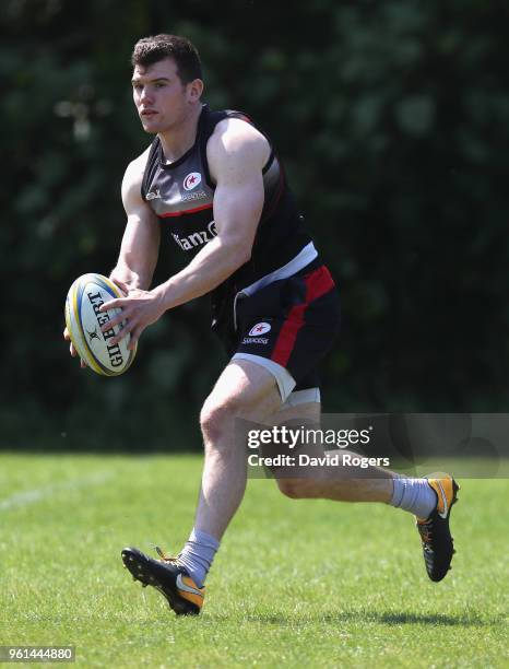 Ben Spencer runs with the ball during the Saracens training session held at Old Albanians on May 22, 2018 in St Albans, England.