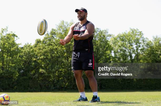 Billy Vunipola passes the ball in the warm up during the Saracens training session held at Old Albanians on May 22, 2018 in St Albans, England.