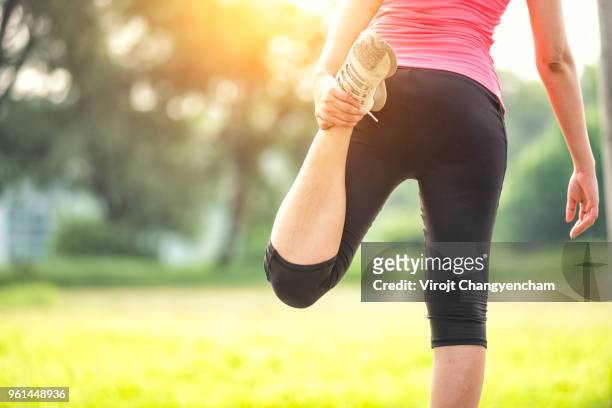 sports girl - leg stretch girl stock pictures, royalty-free photos & images