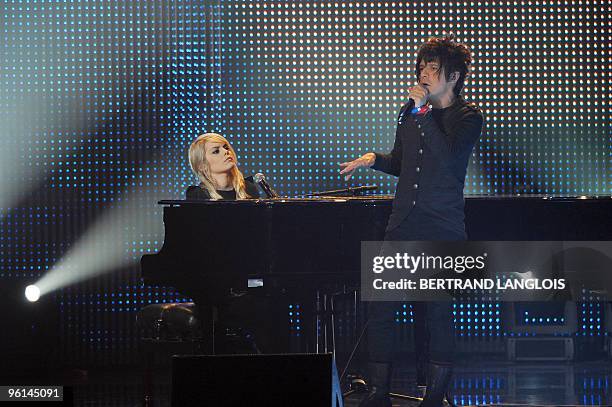 Canadian singer Coeur de Pirate and French singer Nicolas Sirkis, from the band Indochine, perform, on January 24, 2010 at the Zenith in Paris, a...