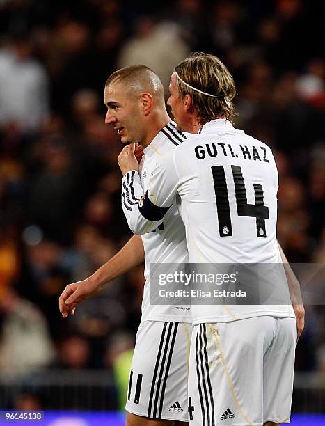 Karim Benzema and Guti celebrate the second goal of his team during the la Liga match between Real Madrid and Malaga at Estadio Santiago Bernabeu on...