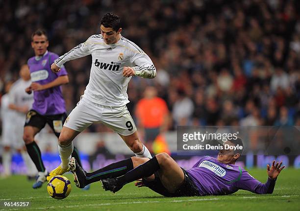 Cristiano Ronaldo of Real Madrid beats ;Ivan Gonzalez of Malaga during the La Liga match between Real Madrid and Malaga at the Santiago Bernabeu...