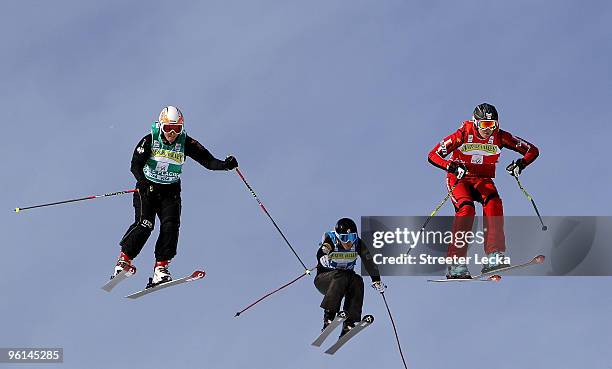 Michelle Greig of New Zealand and Caitlin Ciccone of the USA race against leader Karin Huttary of Austria during the 2010 Freestyle Skiing World Cup...