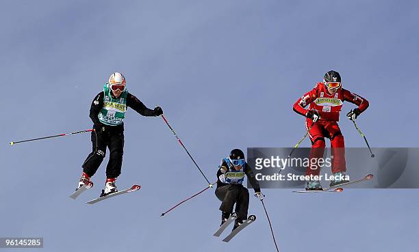 Michelle Greig of New Zealand and Caitlin Ciccone of the USA race against leader Karin Huttary of Austria during the 2010 Freestyle Skiing World Cup...