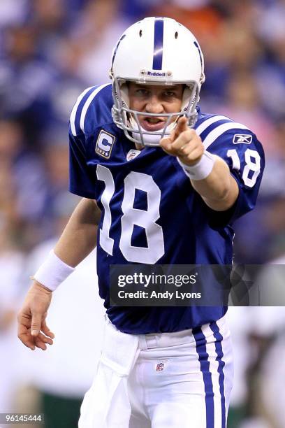 Quarterback Peyton Manning of the Indianapolis Colts points in the first half against the New York Jets during the AFC Championship Game at Lucas Oil...