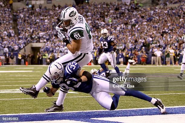 Tight end Dustin Keller of the New York Jets catches a nine-yard second quarter touchdown catch against Raheem Brock of the Indianapolis Colts during...