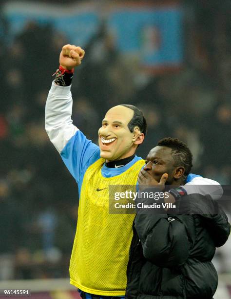 Marco Materazzi, wearing a mask, and Sulley Muntari of FC Internazionale Milano celebrate after winning the Serie A match between Inter Milan and AC...