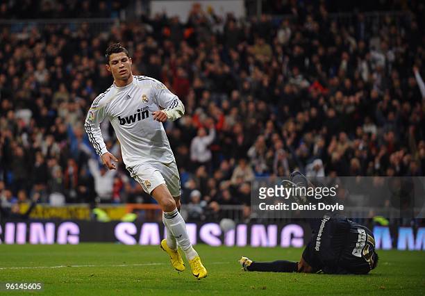 Cristiano Ronaldo of Real Madrid scores his first goal for Real during the La Liga match between Real Madrid and Malaga at the Santiago Bernabeu...