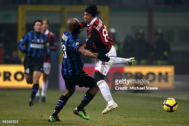 Ronaldhino of Milan challenged by Maicon of Inter during the Serie A match between Inter Milan and AC Milan at Stadio Giuseppe Meazza on January 24,...