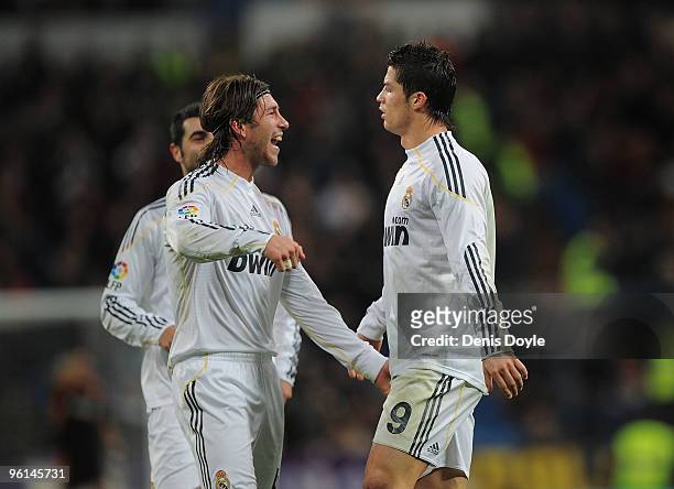 Cristiano Ronaldo of Real Madrid celebrates with Sergio Ramos after scoring his second goal for Real during the La Liga match between Real Madrid and...