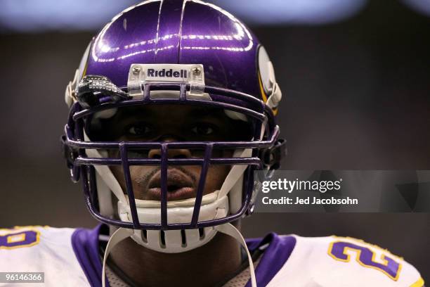 Adrian Peterson of the Minnesota Vikings looks on during warms up against the New Orleans Saints during the NFC Championship Game at the Louisana...