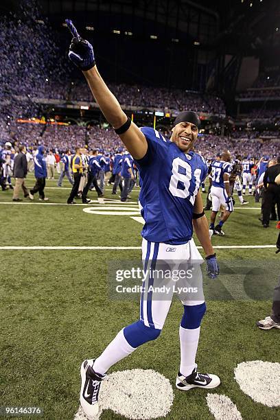 Wide receiver Hank Baskett of the Indianapolis Colts waves to the crowd as he walks off the field after defeating the New York Jets 30-17 to win the...