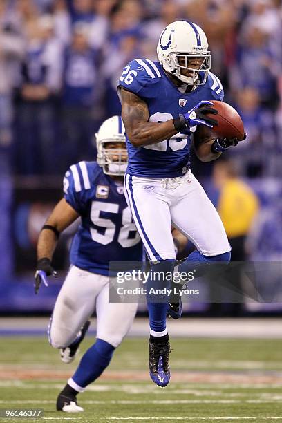 Kelvin Hayden of the Indianapolis Colts intercepts a pass thrown by quarterback Mark Sanchez of the New York Jets in the fourth quarter during the...