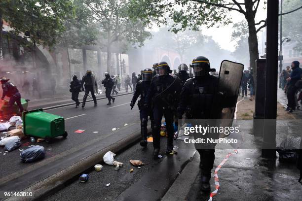 Riot police stand in combat position, on May 22, 2018 in Paris, during a nationwide day protest by French public sector employees and public servants...